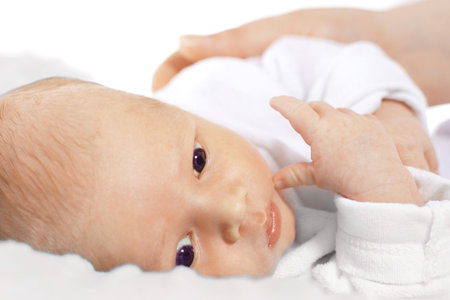 Newborn. A woman holds in her arms her newborn babyの写真素材