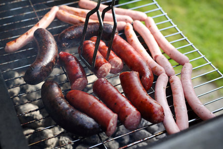 Grilled sausages on the grill.Sausage blood sausage roasted on the grill garden barbecueの写真素材