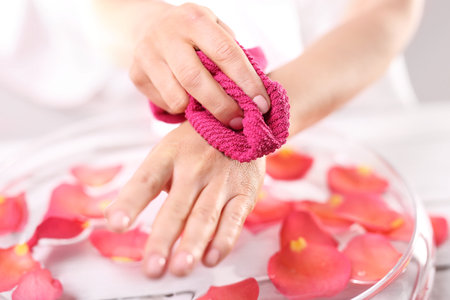 The woman wiped her hands with a towelの写真素材