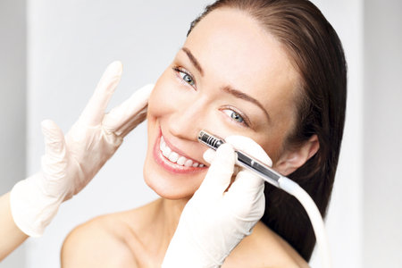 The woman at the beautician, microdermabrasionの写真素材