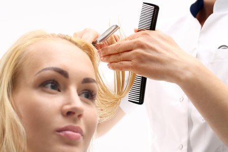 Haircut chinese knife. Barber haircut woman with a knife in a Chinese hair salonの写真素材