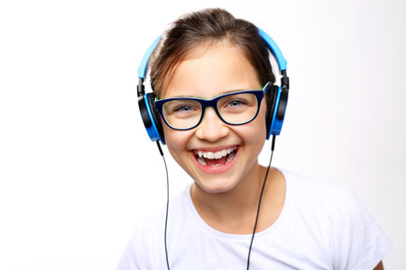The smile and joy. The girl in the headphones on your earsの写真素材