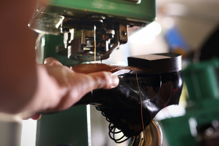 Sewing machine. shoemaker sews shoesの写真素材