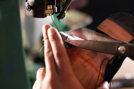 Sewing machine. shoemaker sews shoes