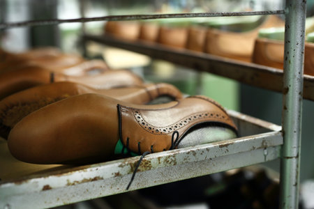 Classic men's elegance, stitched shoes with the cobblerの写真素材