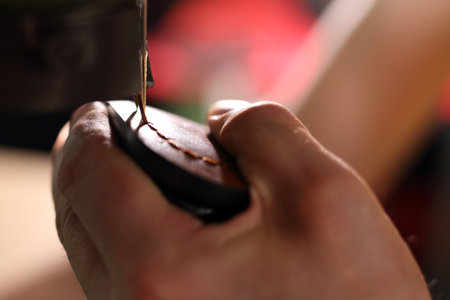 Shoemaker sews shoes. Shoemaker manually performs shoes in the studio craftの写真素材