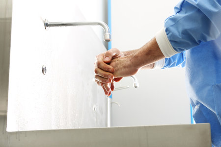 Surgical hand disinfection. The doctor washes his hands, disinfect Their hands before surgeryの写真素材