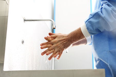 Surgical hand disinfection. The doctor washes his hands, disinfect Their hands before surgeryの写真素材