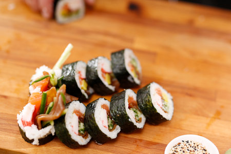 Sushi Master prepares futomakiの写真素材