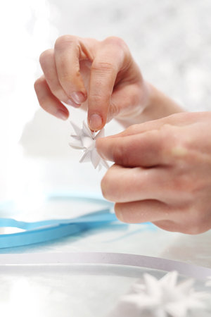 Folding paper star on a Christmas treeの写真素材