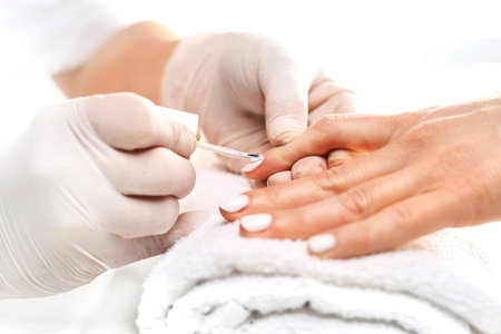 Nail painting .Hands woman during a manicure salonの写真素材