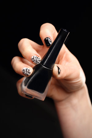 The pattern on the nails black and white manicureの写真素材