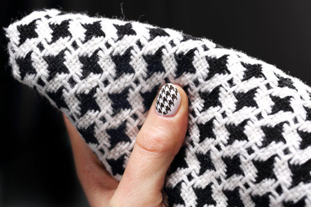 The pattern on the nails black and white manicureの写真素材