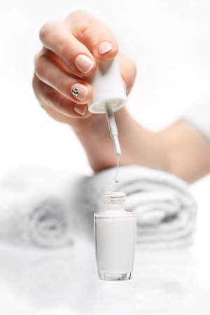 French manicure. Hands woman during a manicure salonの写真素材