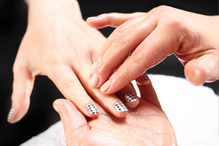 Manicure, hand massage. Massage hand care treatment at the beauty salon.の写真素材