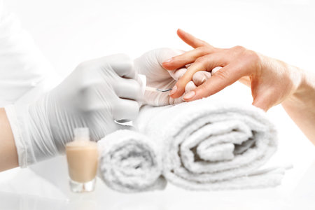 French manicure. Hands woman during a manicure salonの写真素材