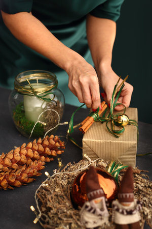 Packaging Holiday Gifts. Christmas decorations idea of a handmade gift.の写真素材