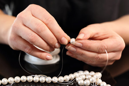 Jeweler and a pearl necklaceの写真素材