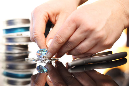 Woman performs necklace with Swarovski crystalsの写真素材