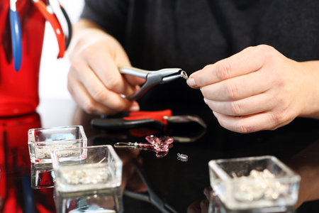 Create an amber necklace in a jewelery workshopの写真素材