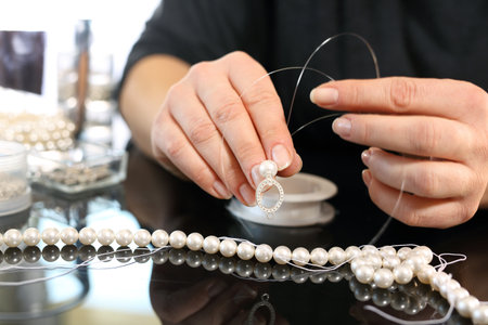 Jeweler and a pearl necklaceの写真素材