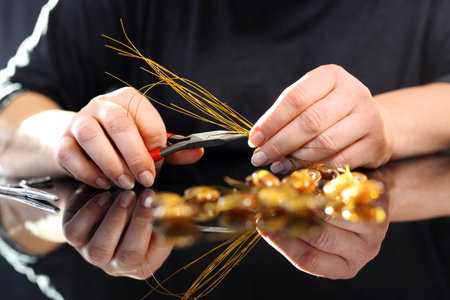 Manufactory, a woman carries jewelry made of amberの写真素材