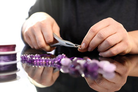 Amethyst, a beautiful purple necklace. Threading beads, jewelry workshopの写真素材