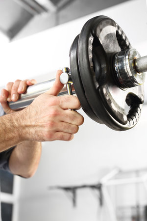 Barbell, the coach does load. Equipment gym equipment dumbbell, barbell weightsの写真素材
