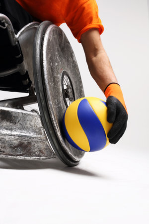 Paralympics. The man on the sports wheelchair with the ballの写真素材