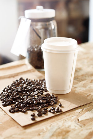 Paper cup of coffee on the counter shopの写真素材