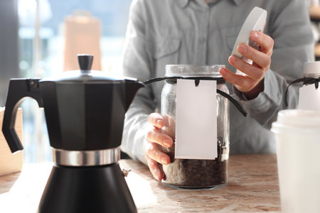 Cafe, barista chooses a species of coffee to brew the coffee machine pressureの写真素材