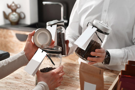 A woman buys a cup of coffee in the coffee shop