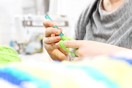 Knitting crochet. The woman knits crochet.の写真素材