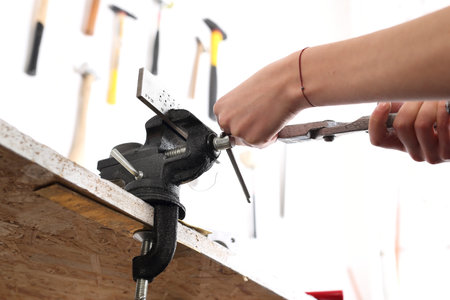 Jeweler's workshop, vise and pliers, the artist at work. Workshop artistic metalwork.の写真素材
