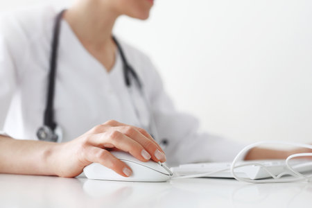 Doctor's office, a doctor at the computerの写真素材