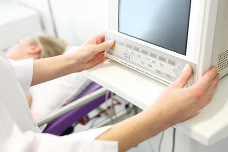 Postoperative room nurse at the bedside patientの写真素材