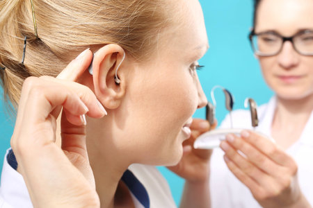 Modern hearing aids. The choice of hearing aid in the doctor's officeの写真素材