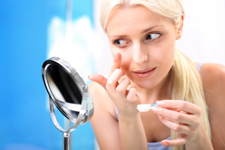 woman assumes contact lenses.の写真素材