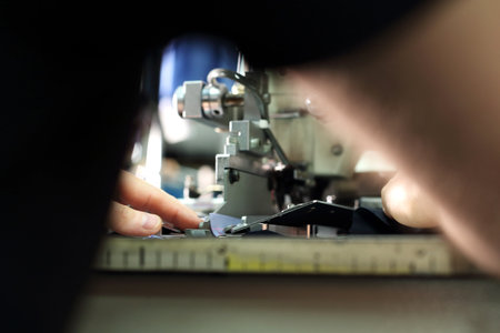 Seamstress on the machine. The production plant, sewing clothes by seamstresses on the sewing machineの写真素材