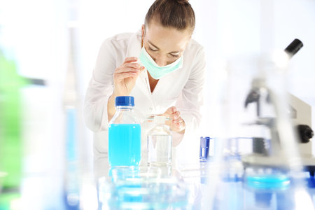 Analysis of the composition of the water. Chemist working in scientific laboratoryの写真素材