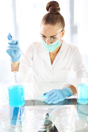 Chemist working in scientific laboratoryの写真素材