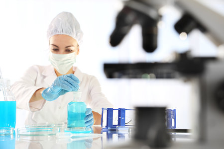Biotechnologist examine the plant samples in the laboratoryの写真素材