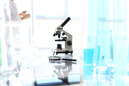 Laboratory biotechnology, microscope Workshop laboratory microscope stands on a glass countertopの写真素材