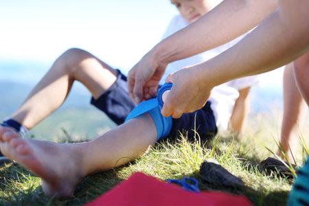 Broken leg, an accident on a mountain trail.の写真素材