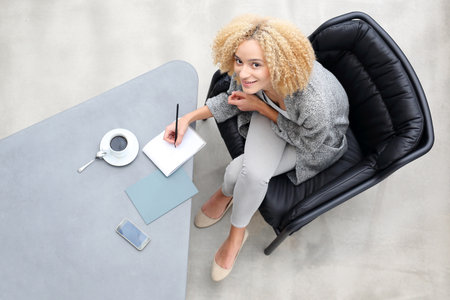 Household bills. Female summarizes expensesの写真素材