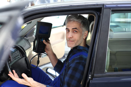 Car mechanic, computer examination car.の写真素材