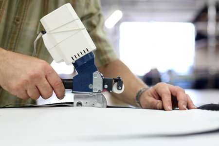 Knife, table punching fabric. Cutting room, cutting cloth tailoring knife.の写真素材