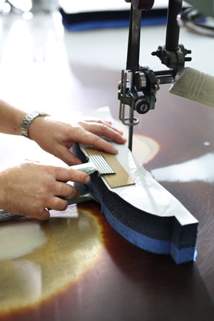 Knife, table punching fabric. Cutting room, cutting cloth tailoring knife.の写真素材