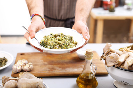 Vegan dish. The cook prepares a dish dinner.の写真素材