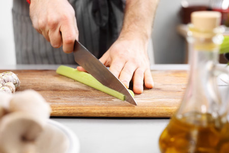 Cutting vegetables. Cook chopped vegetables on a chopping board.の写真素材